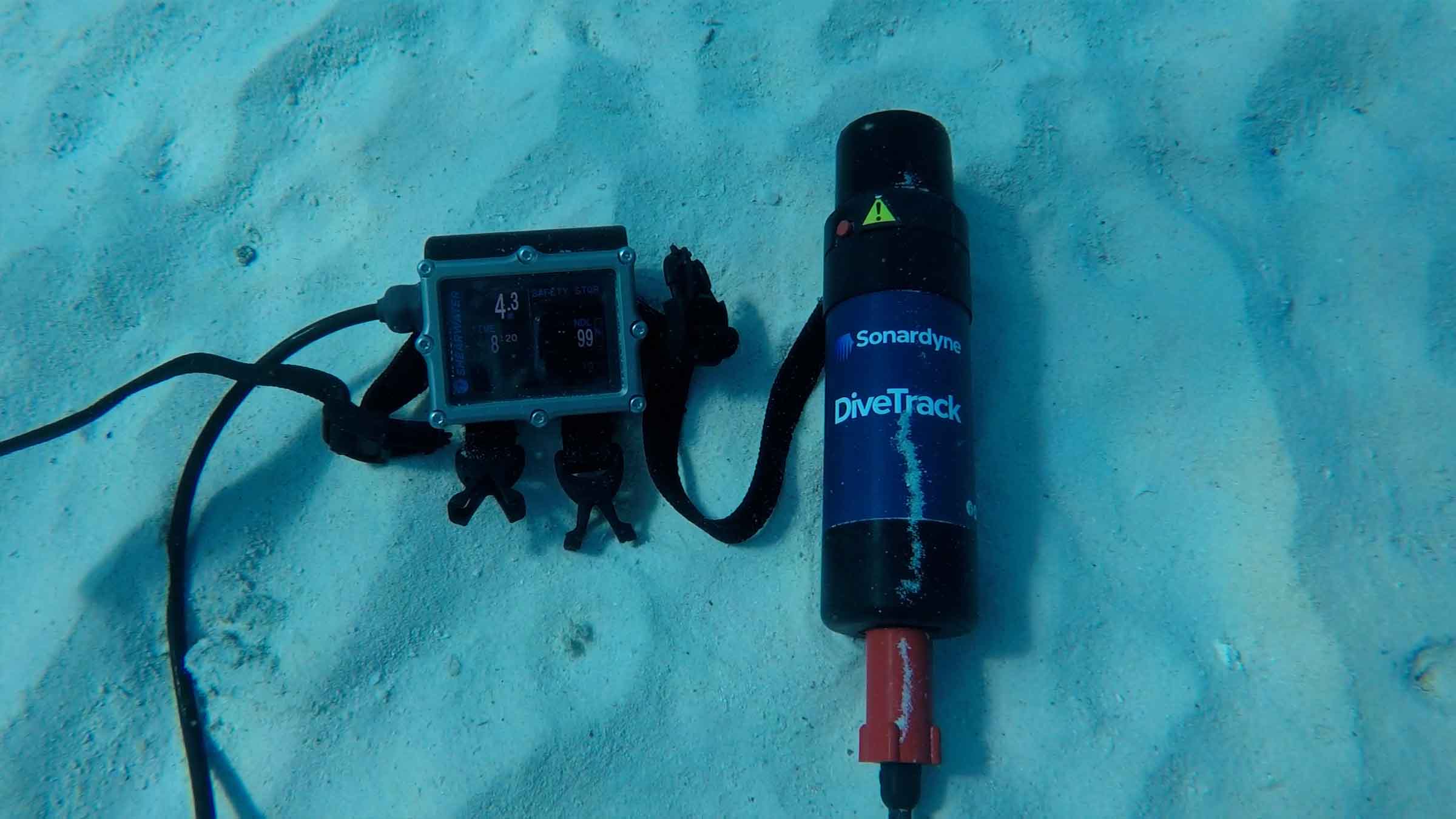 DiveTrack transponder and Shearwater watch on seabed