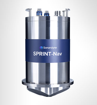 A metallic cylindrical device named SPRINT-Nav by Sonardyne, featuring a blue band with white text, various connectors on top, and a tapered, pointed base, against a light gray background.