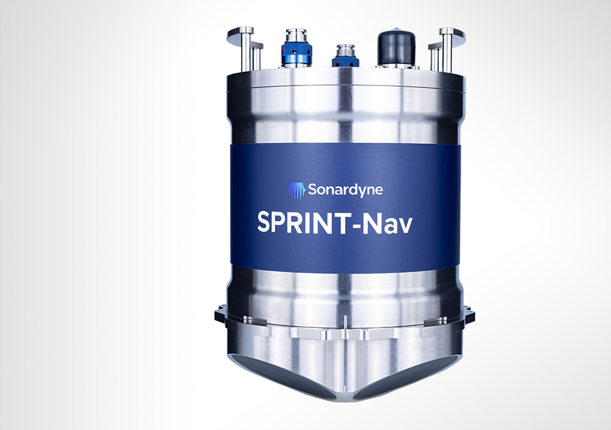 A silver cylindrical Sonardyne SPRINT-Nav device with a blue label, featuring various connectors on top and a tapered bottom.