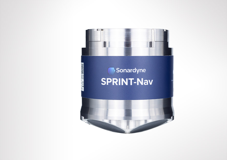 A cylindrical Sonardyne SPRINT-Nav device with metallic ends and a blue central band, shown against a white background.