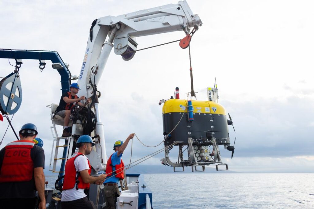 Mesobot-team-members-Lui-Kawasumi-and-Eric-Hayden-deploy-the-vehicle-off-the-Nautilus.-Photo-by-Marley-Parker_Ocean-Exploratoin-Trust.jpg